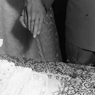 Cutting the wedding cake (close up)