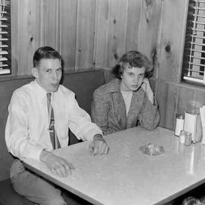 Man and woman in a restaurant booth