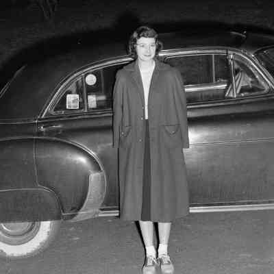 Woman in front of car