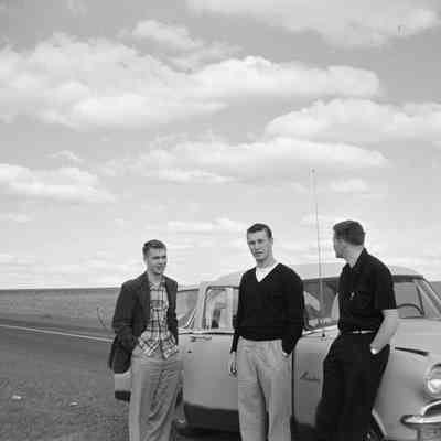 People and a car in the country