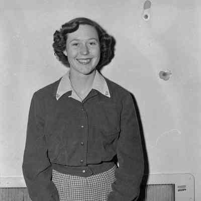 Woman in front of heater