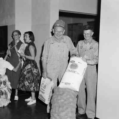 Old men with food sacks
