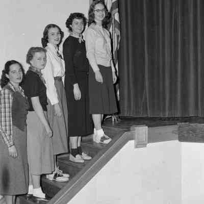 Women on stage steps