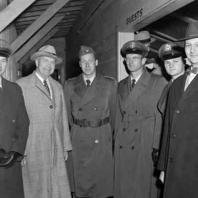 Six men in overcoats