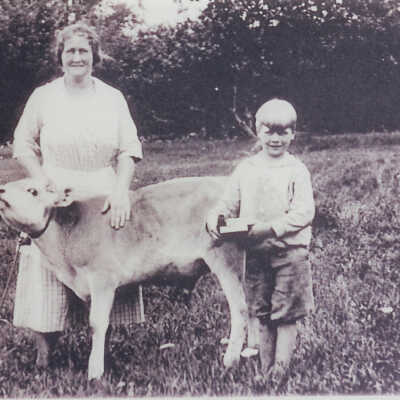 Boy and woman with calf