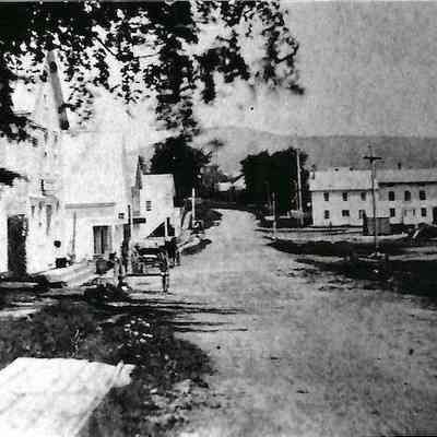 Sidewalk and dirt road: view looking north