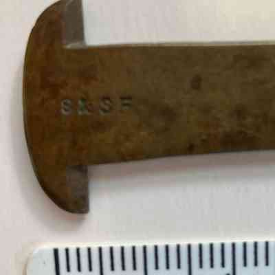 close-up showing initials "S & SF"