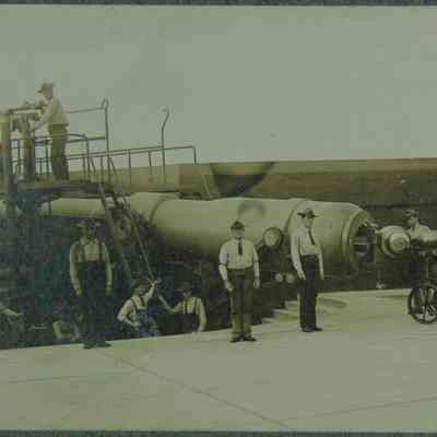 Men loading artillery cannon