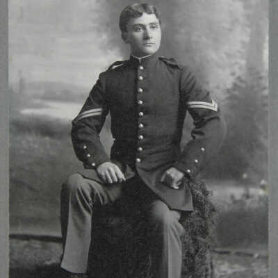 Portrait, male, sitting full figure in uniform