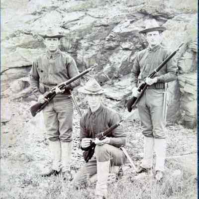 3 men with rifles