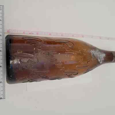 Embossed brown bottle