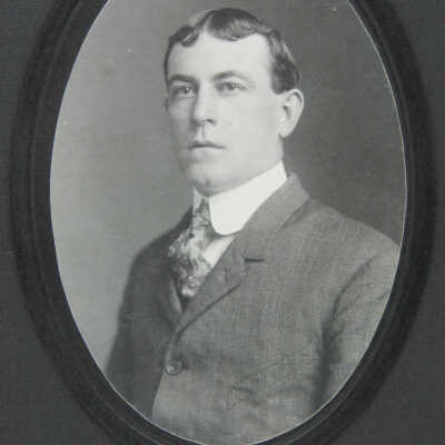 Bust portrait male in coat and tie