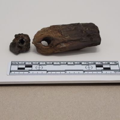 Metal fragment. Wood with hole. NW Bastion 8/16/76