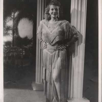 Photo - "Joy Davis" "Hula Lo" written on back "Property of Dixie Evans" stamped on back "S&S File Productions" Fringe dress