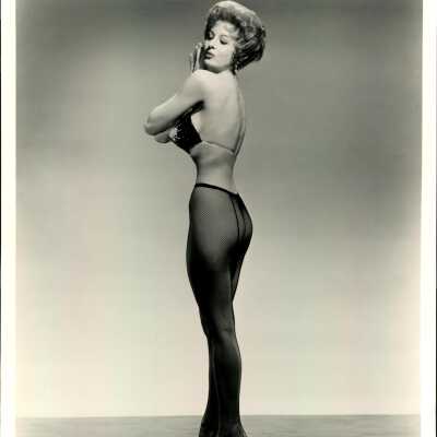 Photo - Tempest Storm-fishnets and bra. Maurice Seymour B&W