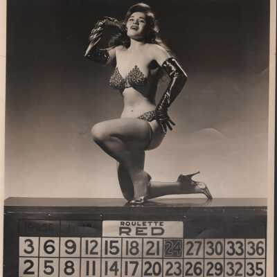 Photo - B+W- Crystal La-Vegas " And Her Golden Nugget" Bikini cut outfit on a Roulette/ Keno type prop