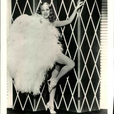 Photo - Sally Rand-Standing like a flamingo-covered by feather fan-B&W