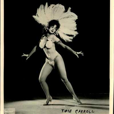 Photo - Toni Carrol-B&W-Fuzzy Bra, Feather Head Piece, G-String, fishnet stocking
