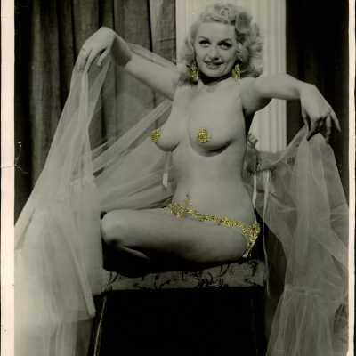 Photo - Dixie Evans, robe, nude w/ glitter cover over
