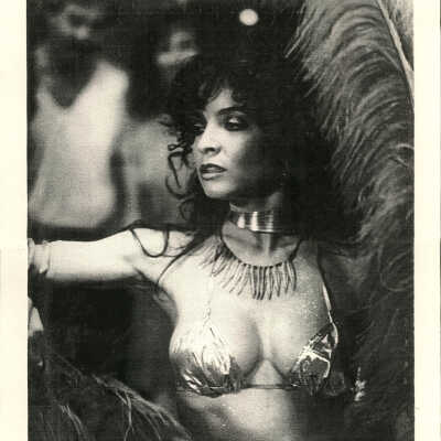 Photo - Toni Alessandrini-B&W-Bust Shot-Shiny Bra-Giant Feathers