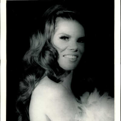 Photo - Tiffany Carter-B&W-Bust Shot-Holding feathers over chest
