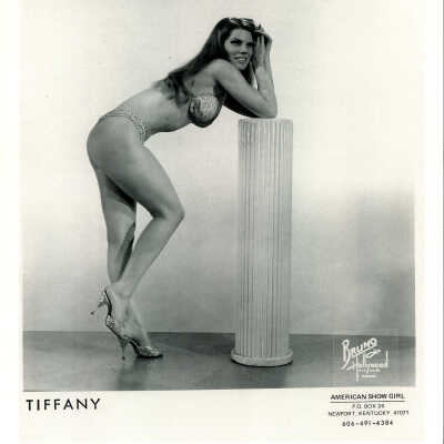 Photo - Tiffany Carter-B&W-Bra, g-string and sparkly high heels-leaning on pillar