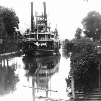 Steam Boat Navigating A Lock
