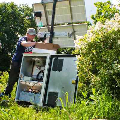 Ohio Geological Survey IMG_7690: Jacqueline Thompson performing maintenance on seismic station at Lake Erie Bluffs Nature Preserve in June 2022.
Photo and archived by Molly E. Hunt