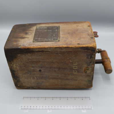 Explosives Detonator Box: It is a worn wooden box with explanatory labels on the side, and has metal wire connectors and a wood handled plunger at the top.