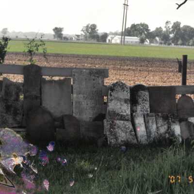 Row of Tombstones Along Fence