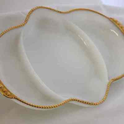 White ceramic dish with gold trim
