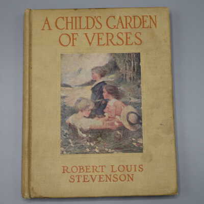 Book with yellow cover and multicolored central image of children in a garden