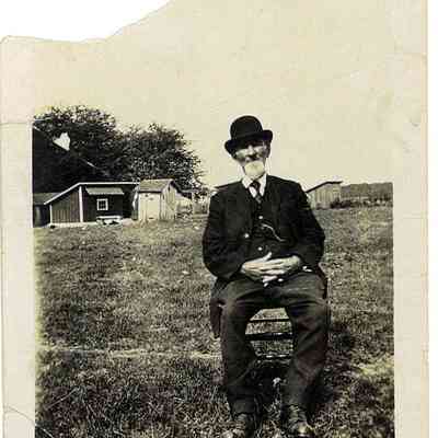 Photo of Unidentified Man Sitting in a Field in the Mohler/Follett Family