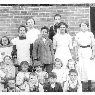 Photo of Jenny Shoemaker(Gutemore) (1904-91) and Harold Bollman (1906-89) with Unidentified Students at the Liberty Twp. School