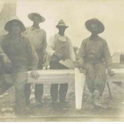 Photo of Four Unidentified Men Working with Lumber from the Mohler/Follett Family