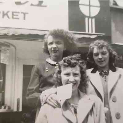 Joanne McColley, Jane Hess & ? in front of Schaff's Rexall Drug Store, Napoleon, Ohio