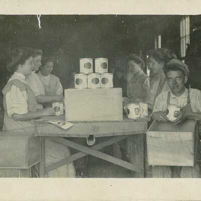 Employees labeling Liberty Bell Tomatoes at Young - Newland Canning Factory
