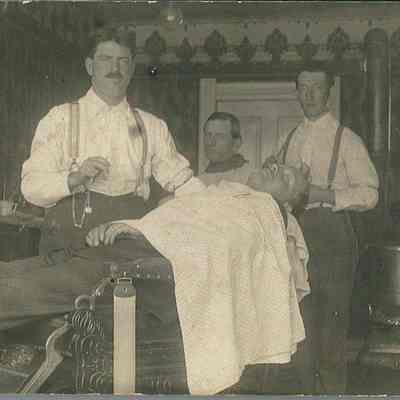Barbers Billy Bowers and O. R. Minnich at Work in Their Shop