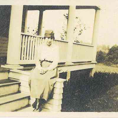 Photo of Unidentified Woman on House Porch from the Mohler/Follett Family