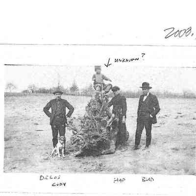 Delos, Hap and Bud Kniss by Trash Pile (Child is UnIdentified)