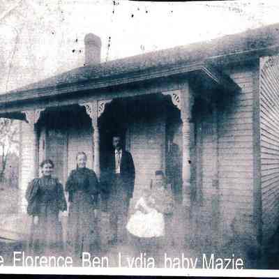 Mable, Florence, Ben, Lydia with baby Mazie on porch of Kniss Shoe Repair Shop