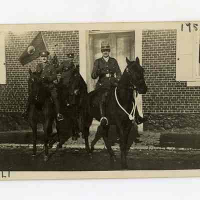 Postcard "A RPPC of two 4th Battalion officers and a flag bearer on horseback in France."