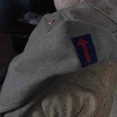 Machine Gun Corps Service Dress Jacket on display in the "Vickers Machine Gun" Exhibition - close up on shoulder patch