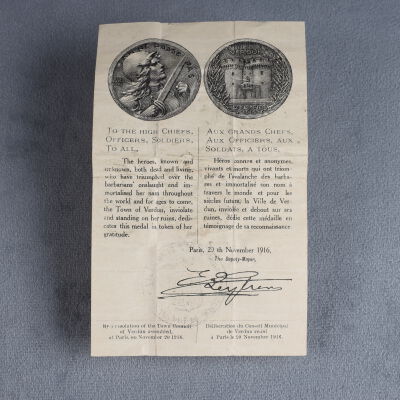 The paper associated with the medallion