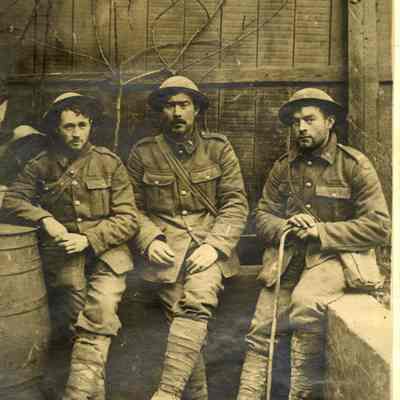 Photograph "A postcard showing three Canadian soldiers of the 1st battalion."