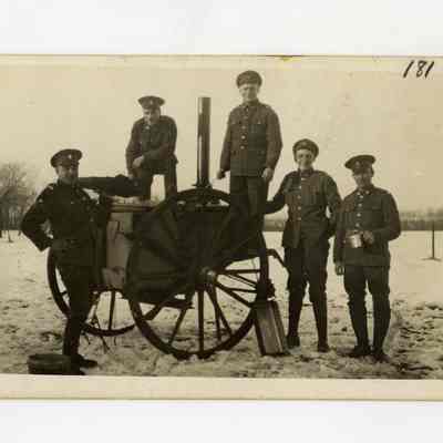 Postcard "Unidentified RPPC of five 4th Battalion soldiers posed in front a field kitchen."