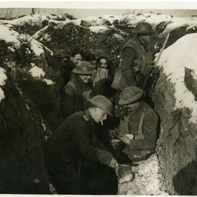Photograph "British Army Tommies Eating in the Trenches."