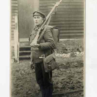 Postcard "An unidentified RPPC of a 5th Battalion soldier in full kit, including rifle with bayonet."