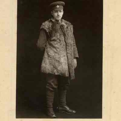 Photograph "Studio portrait of an unidentified 1st battalion private in a sheepskin coat."