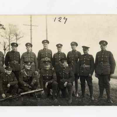 Postcard "Unidentified RPPC of twelve 4th battalion men in France. Lewis Gun section. 1917."